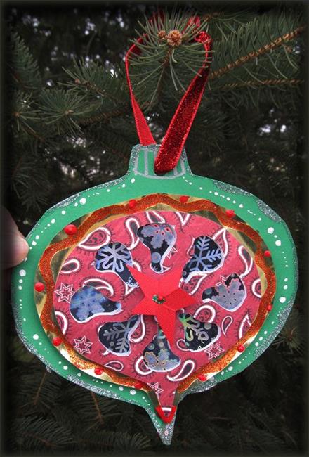 Art: Christmas ornament collage paper cutting by Artist Ann Murray