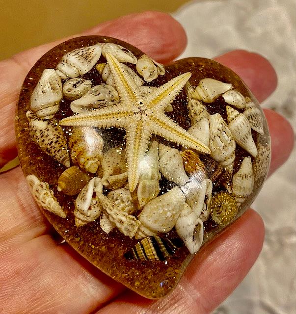 Art: Heart inlaid with sand, shells and sea star by Artist Ulrike 'Ricky' Martin